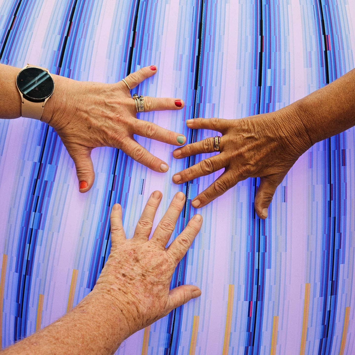 three hands joined together